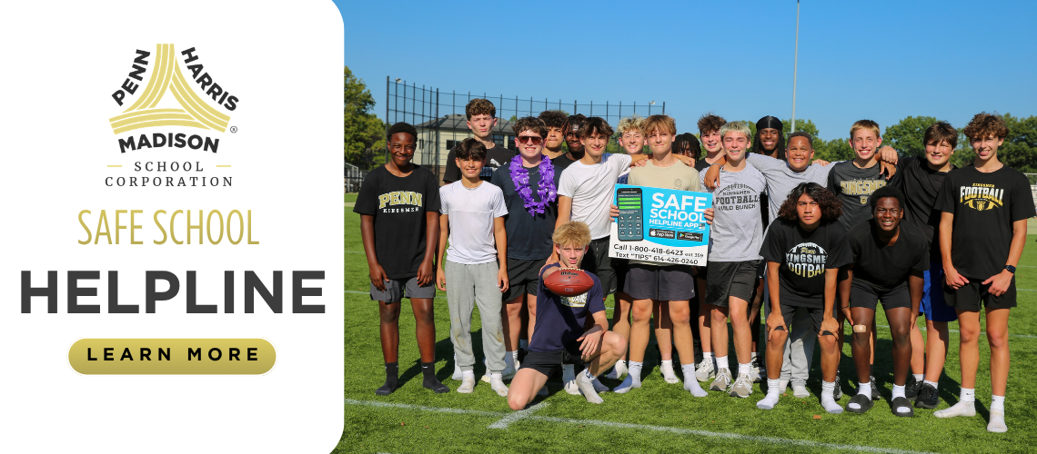 The team is posing on a football field.
